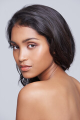 Fototapeta premium Glow, beauty and portrait of woman in studio with health, wellness and natural facial routine. Confident, cosmetics and face of female person with skincare dermatology treatment by gray background.