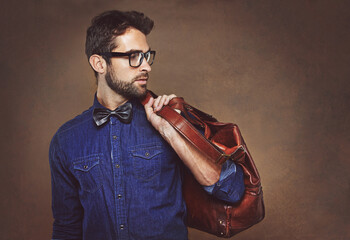Travel, bag and man with fashion thinking of vacation in studio, background and mockup for...