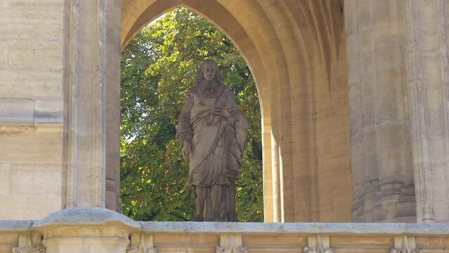 Statue of Blaise Pascal under the Saint Jacques Tower in Paris, France