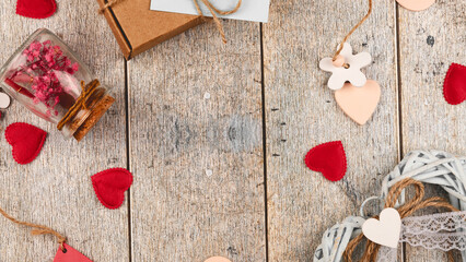 Romantic background. Wooden white background with red hearts, gifts
