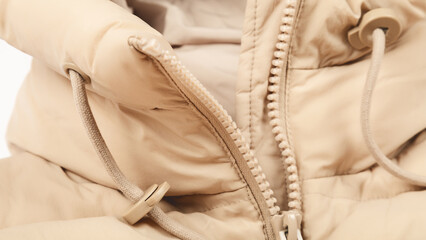 Close-up on blue puffer jacket. women winter fashion concept