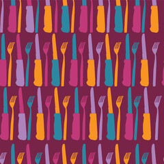 Bold and bright coloured cutlery in a horizontal pattern formation on dark purple background