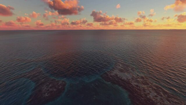 Sunset aerial drone view of The Great Blue Hole on the coast. Belize