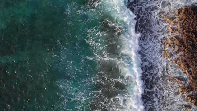 Close aerial view drone of waves. Close push in to sea waves