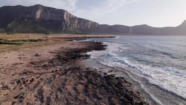 Aerial view drone of sea cost. Flying close to the sea surrounded by mountains