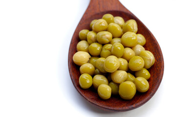 Canned green peas on white background.