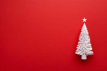 Naklejka na ściany i meble a white christmas tree with a star on top