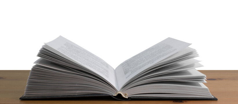 Open book on a wooden table, transparent PNG.