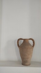 ceramic vase on the wall