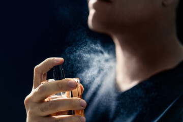 Fragrance spray. Man and perfume. Applying cologne. Scent water. Skin care, beauty product and male...