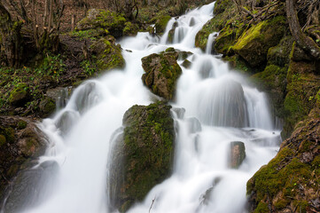 Fototapeta na wymiar iView of the Kephalovriso waterfall on Mount Gramos near the village of Pefkofito in Macedonia, Greece