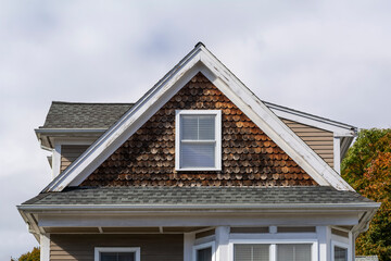 Shingled gable end of a family house in Brighton, MA, USA