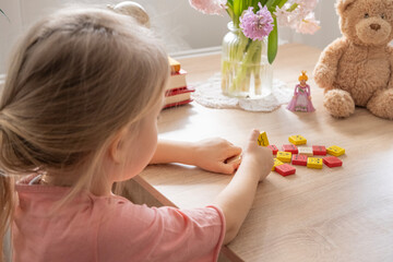Obraz na płótnie Canvas close-up plasticine toys in hands of toddler, small child 5 years old, child learning about emotions through play, emotional intelligence in early childhood, Diversity and inclusion