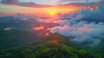 Fototapeta na wymiar Sun Setting Over Clouds in Mountains