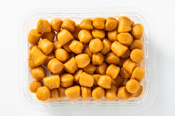 uncooked Italian gnocchi on a white background