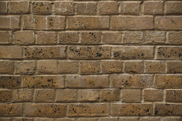 Building exterior, roughly textured brown brick wall  background