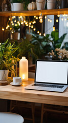 Laptop with blank screen on wooden table in cafe,