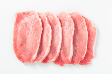 uncooked Pork loin steak on white