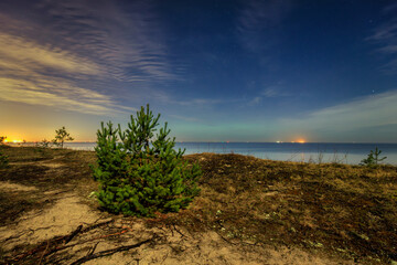 A beautiful beach of the Sobieszewo Island at the Baltic Sea at night. Poland