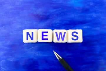 NEWS word made by white soap on blue paper
