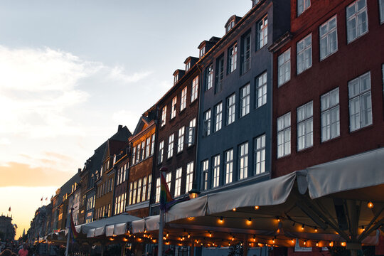Copenhagen, Denmark - August 30, 2021. Famous Nyhavn pier with colorful buildings and boats in Copenhagen, Denmark