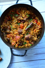 lamb stewed with tomatoes and orzo, background of greek traditional food youvetsi