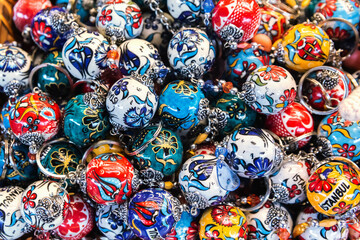 Traditional Turkish ceramic keychains, boasting intricate Iznik designs in a bold palette. Istanbul, Turkey (Turkiye)