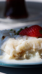 Ramadan Dessert Gullac - Close-Up Shot on Table.
This captivating close-up shot showcases a delectable serving of Gullac, a traditional Turkish dessert typically enjoyed during Ramadan. 