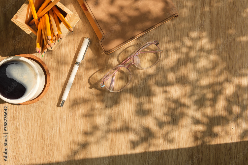 Canvas Prints top view glasses, coffee cup and notebook on wooden table. copy space for your text.