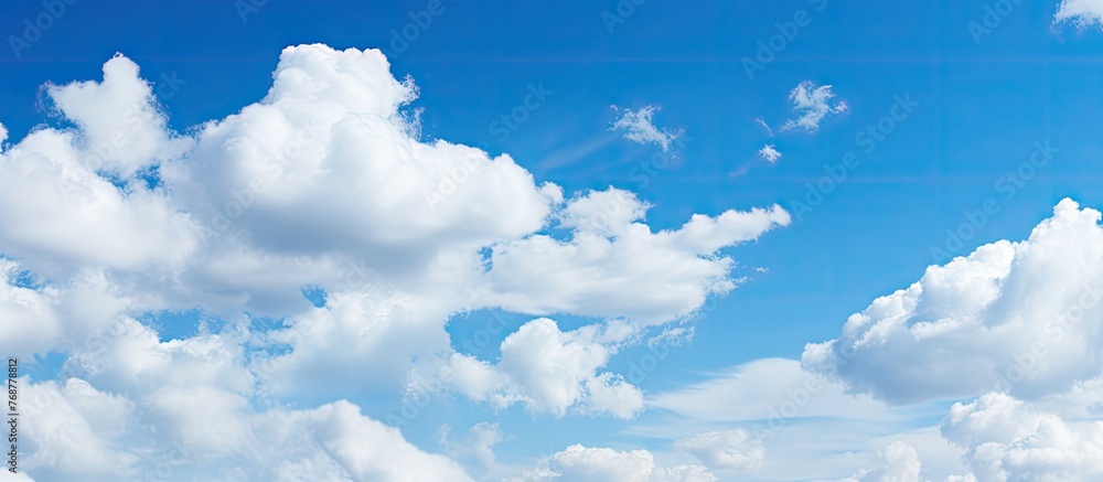 Poster multiple individuals enjoying a sunny day at the beach with a colorful kite soaring in the clear blu