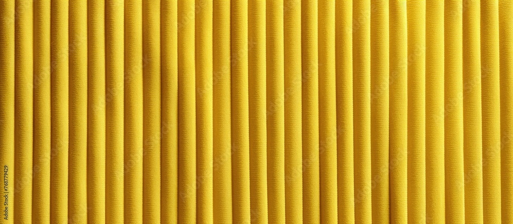 Poster A close-up of a textured yellow fabric featuring vertical pleats and lines, creating a unique background