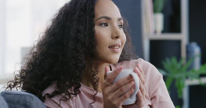 Woman, thinking with coffee and mindfulness for peace and future, inspiration with memory and relax at home on sofa. Ideas, day dream and break with latte or tea, life and health with wellness