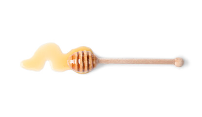 Wooden dipper and fresh honey on white background, top view