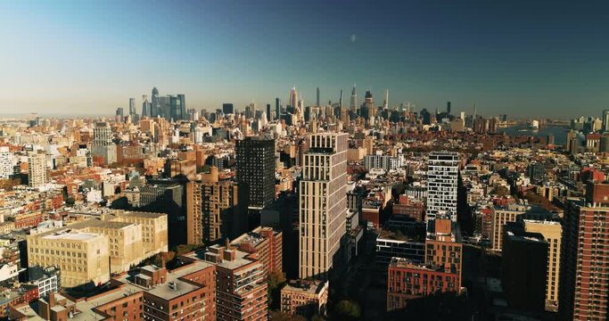 Sunny aerial view of urban landscape of New York City. Drone perspective,