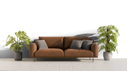a brown couch with pillows and a plant