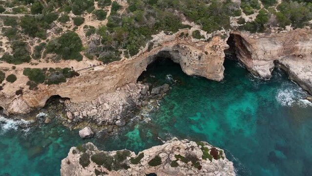 view of the coast from the sky, blue sea, rocks and amazing view with the drone. island of mallorca Spain