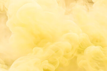 Light yellow puffs of smoke, abstract background.
