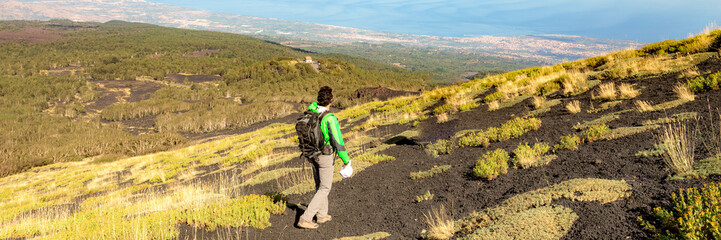 Mount Etna in Italy, Sicily. Climb Etna volcano to the top. Banner Web with copy space.