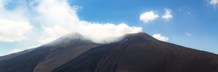Mount Etna in Italy, Sicily. Climb Etna volcano to the top. Banner Web with copy space.
