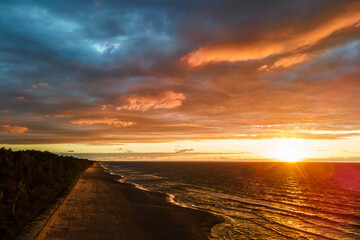 sunset by the sea, colorful clouds - obrazy, fototapety, plakaty