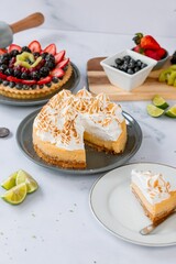 Vertical shot of a yummy lemon cake decorated with whipped cream.