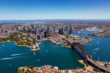 Obraz premium an aerial view of sydney with the harbor and city centre in the distance
