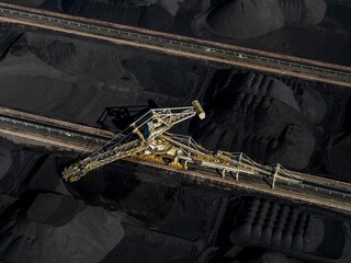 an aerial view of a huge coal mine in the middle of the desert