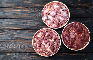 Raw chicken giblets raw poultry meat set : liver, stomach and heart