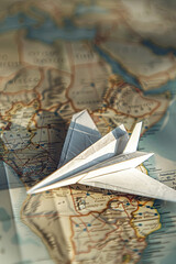 A paper plane on a map
