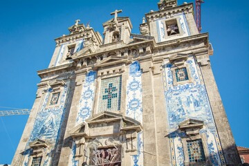Fototapeta na wymiar Low-angle shot of Church of Saint Ildefonso in Porto, Portugal
