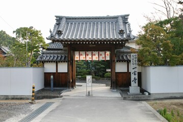 this chinese building is set on the street in front of an asian house