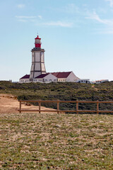 Fototapeta na wymiar landscape of Cape Espichel Lighthouse on cliff in Sesimbra, Portugal