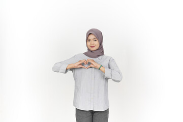 Young Asian woman wearing hijab showing love heart sign isolated on white background