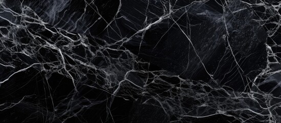The black and white marble texture serves as a luxurious backdrop for interior design, such as kitchen floors, worktop counters, walls, and flooring. Its intricate patterns and sleek finish add a